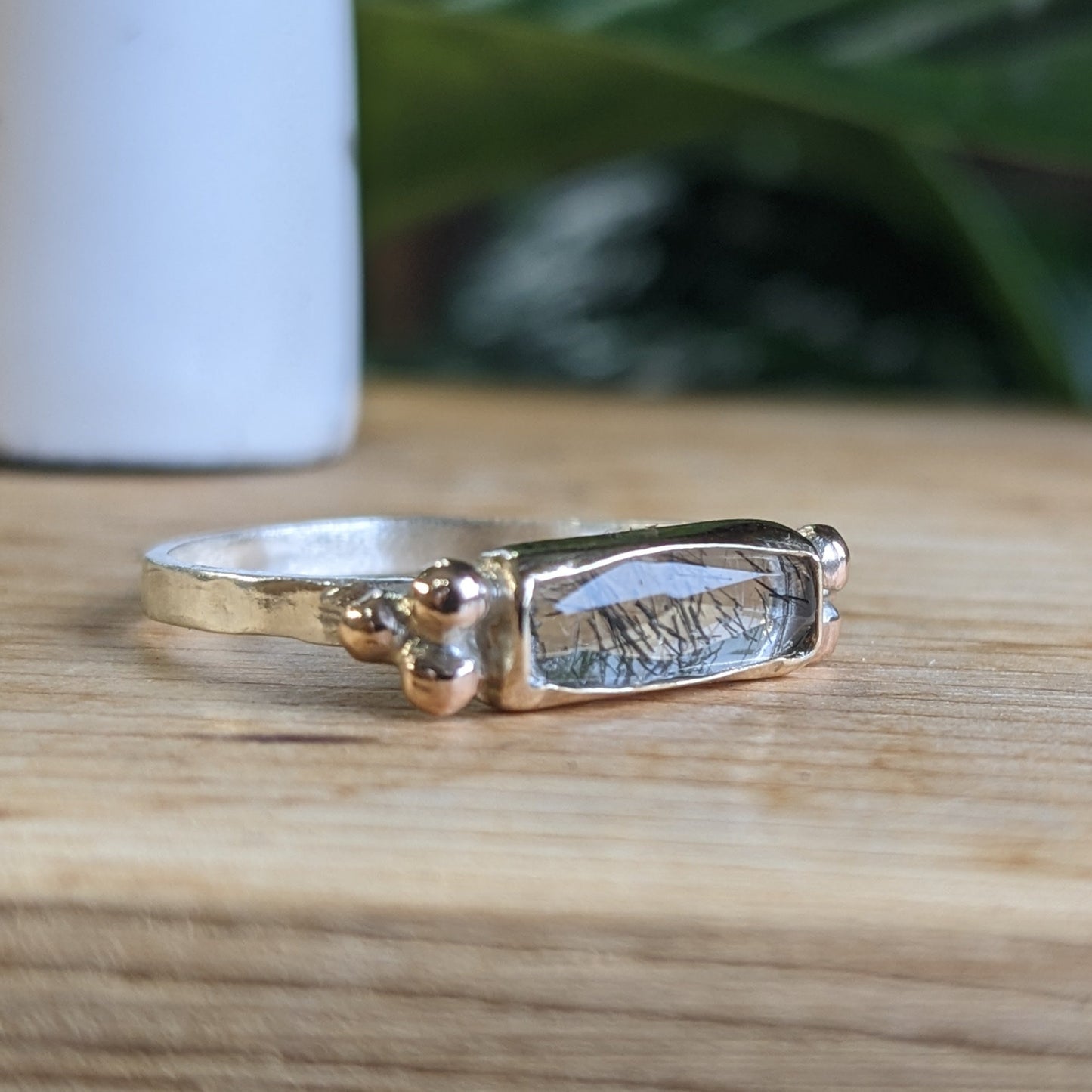 Black tourmaline rutilated quartz with gold accents and silver band