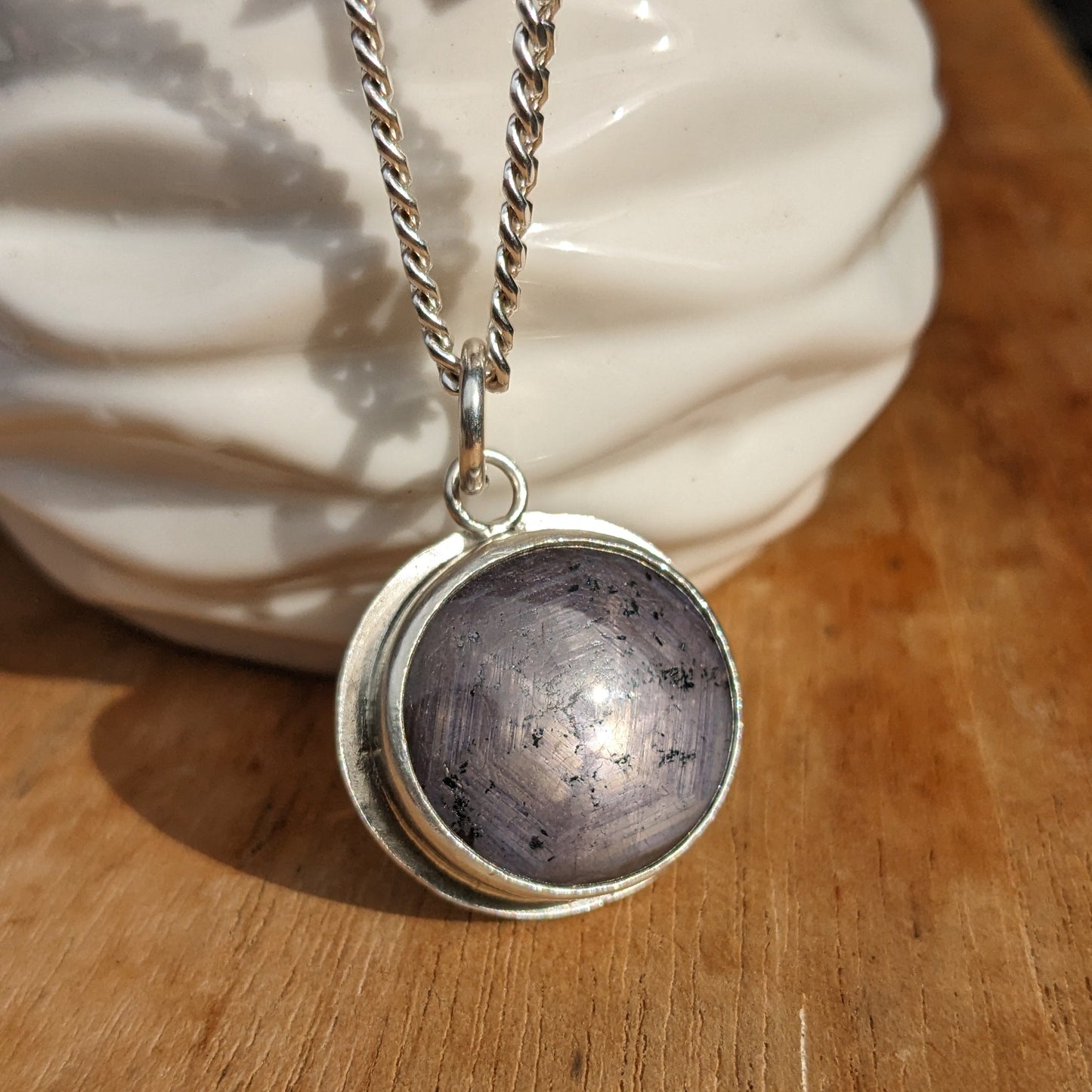 Dark purple star cut ruby pendant