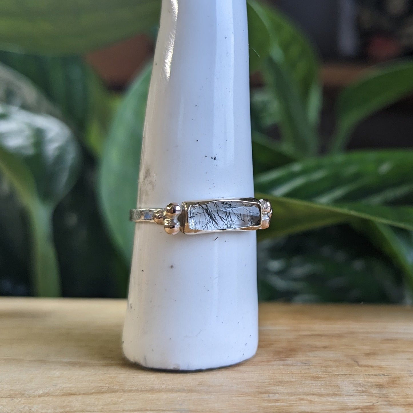 Black tourmaline rutilated quartz with gold accents and silver band