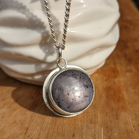 Dark purple star cut ruby pendant