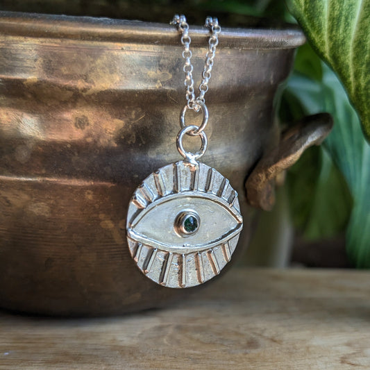 Evil eye protection medal with Emerald