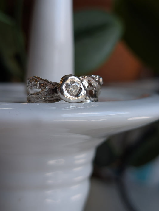 Moissanite heart and flowing silver ring